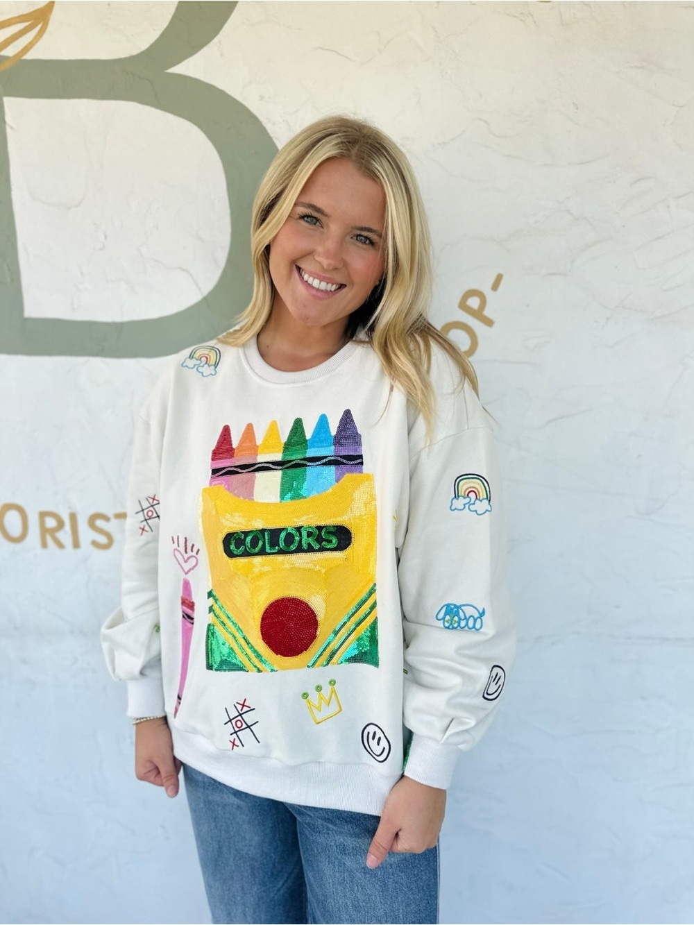 QUEEN OF SPARKLES White Sweater with Multicolor Crayon Box Graphic